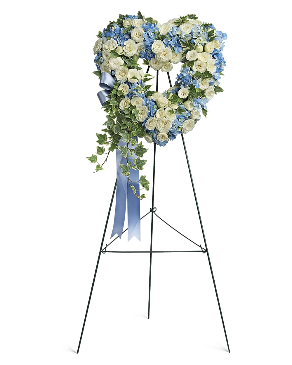 Blue hydrangea and white rose heart-shaped funeral wreath on an easel